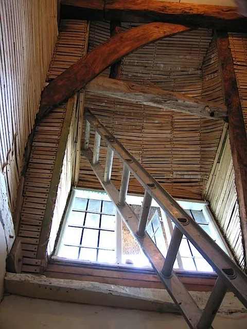 Split oak laths lining the inside of a roof, around a window