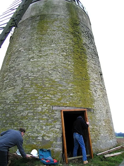 Fitting a replacement door and frame at the foot of a stone windmill